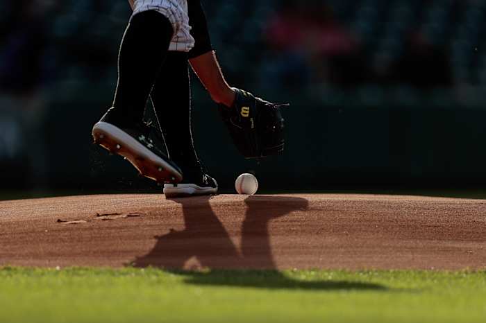 Jun 2, 2021; Denver, Colorado, USA; Colorado Rockies starting pitcher Antonio Senzatela (49) picks up the game ball from the mound before the game against the Texas Rangers at Coors Field.